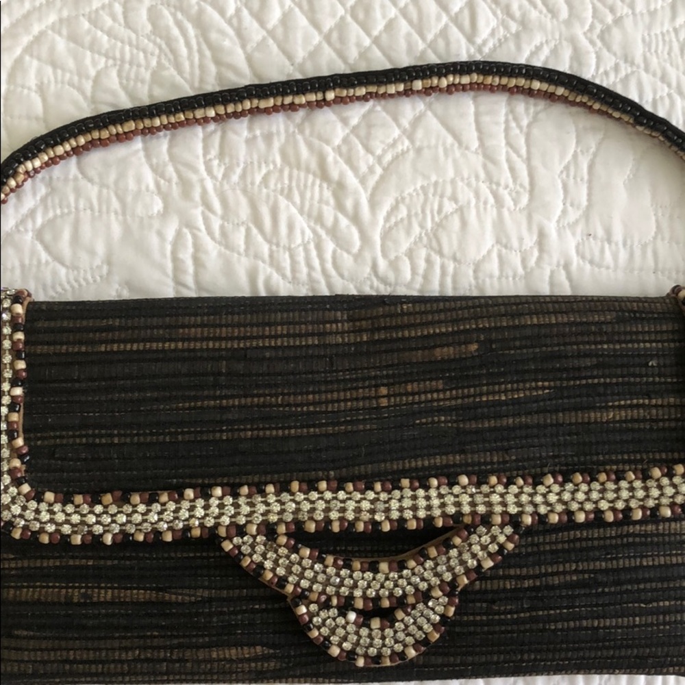 Black tan clutch bag by Skemo